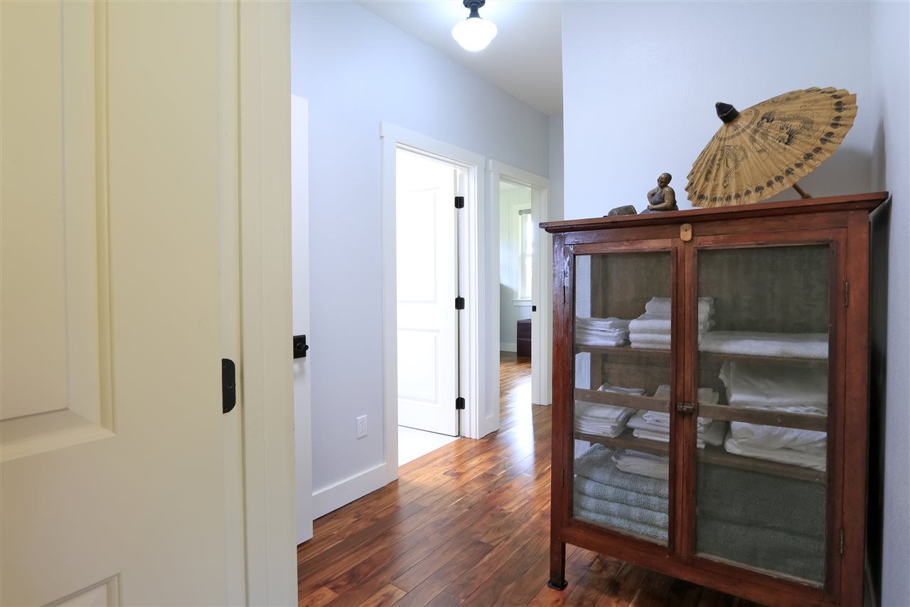 2736 Kaupakalua Road Haiku, HI 96708 - Photo 16 of 30 a view of a hallway with wooden floor
