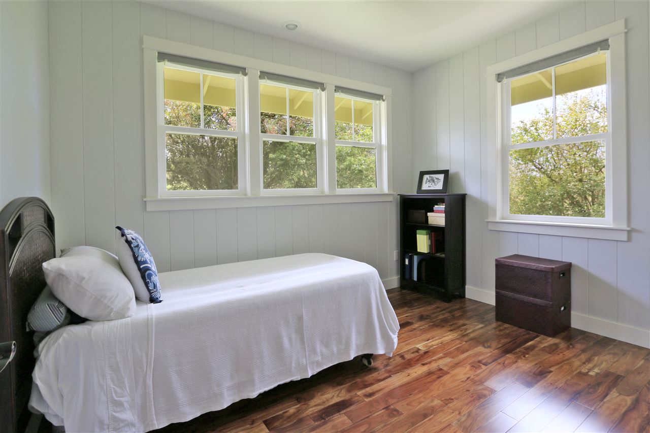 2736 Kaupakalua Road Haiku, HI 96708 - Photo 18 of 30 a bedroom with a bed and a window
