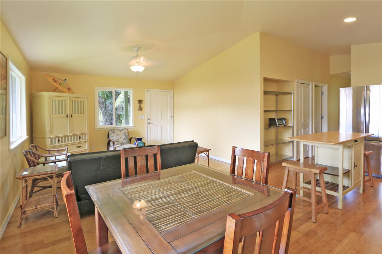 2736 Kaupakalua Road Haiku, HI 96708 - Photo 24 of 30 a view of a dining room with furniture and wooden floor
