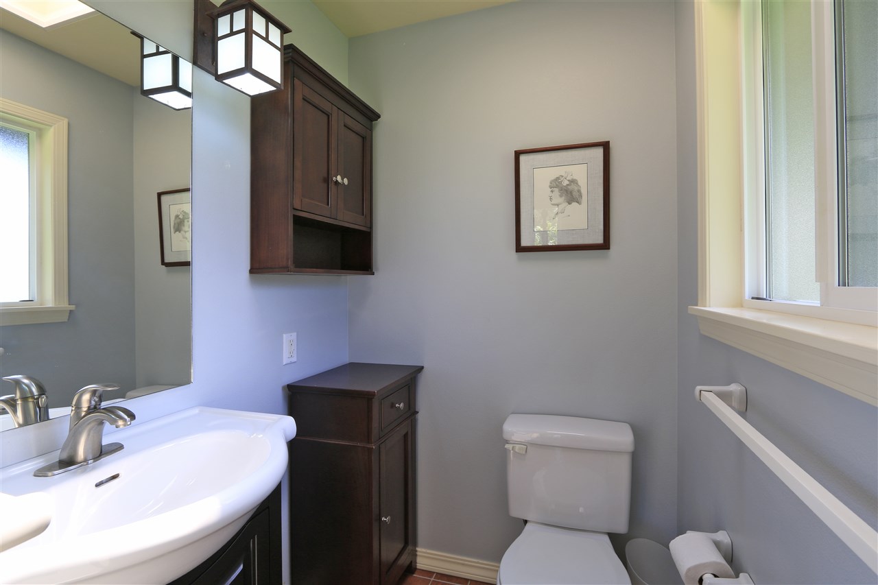 2736 Kaupakalua Road Haiku, HI 96708 - Photo 29 of 30 a bathroom with a toilet a sink and mirror