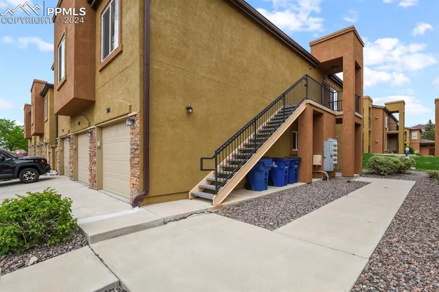 a view of a house with a small yard