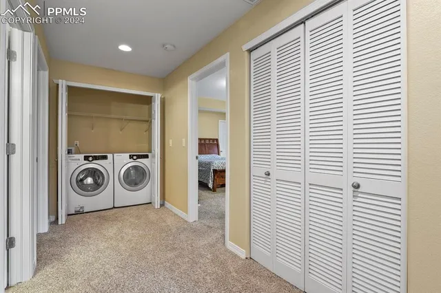 a view of a livingroom with a fireplace and a window