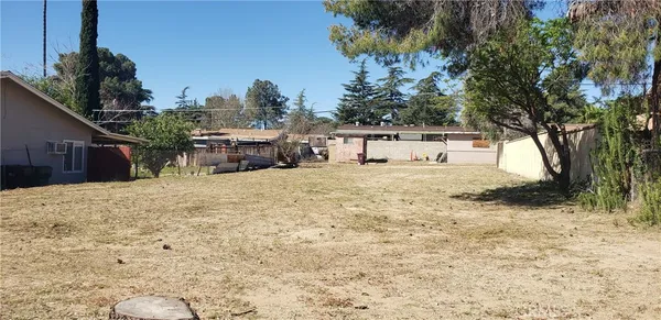 a view of a house with a snow in the yard