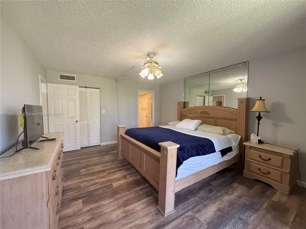 a bathroom with a double vanity sink toilet and shower