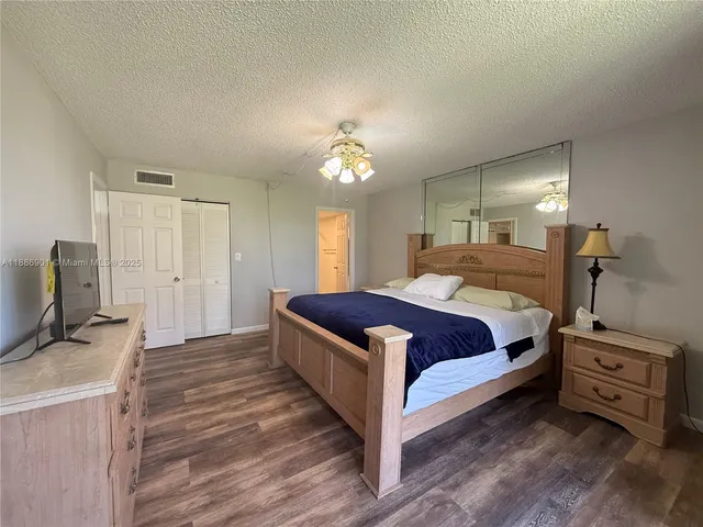 a bathroom with a double vanity sink toilet and shower