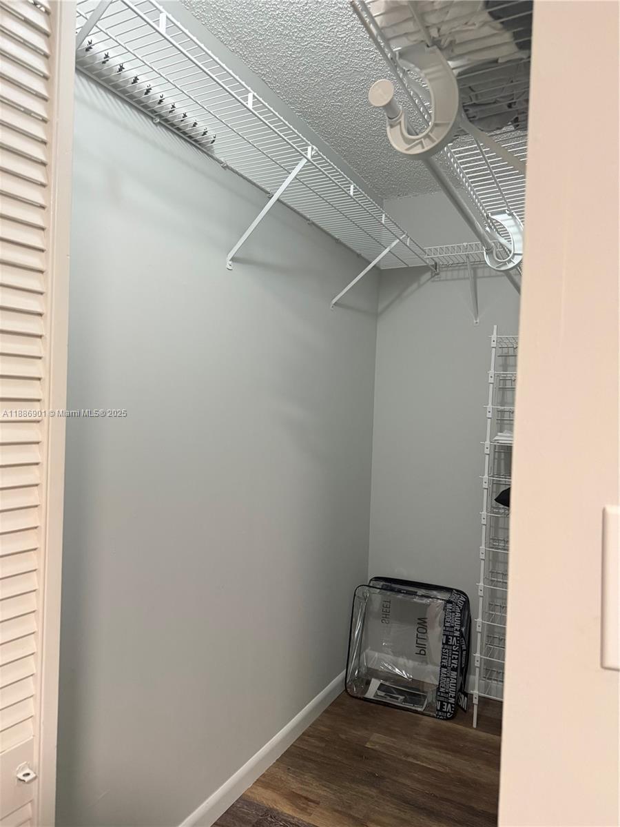 1627 Riverview Road, Unit 212 Deerfield Beach, FL 33441 - Photo 9 of 27 a room with a wooden floor and a window