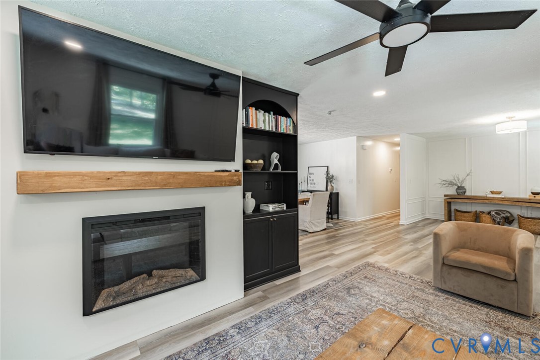 12397 New Market Mill Road Beaverdam, VA 23015 - Photo 5 of 44 a living room with stainless steel appliances kitchen island furniture and a fireplace