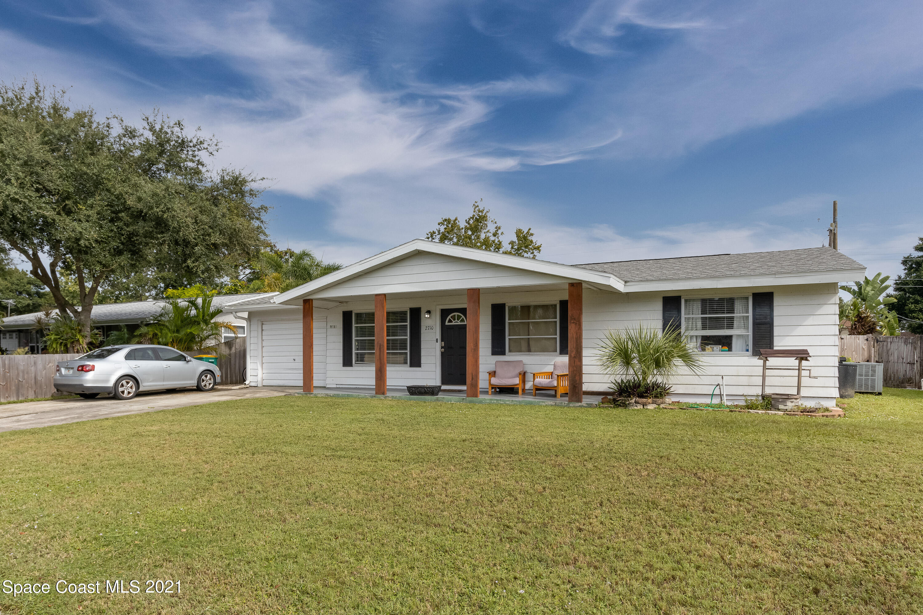 2710 King Richard Road Melbourne, FL 32935 - Photo 2 of 17 a view of a house with a garden and pathway