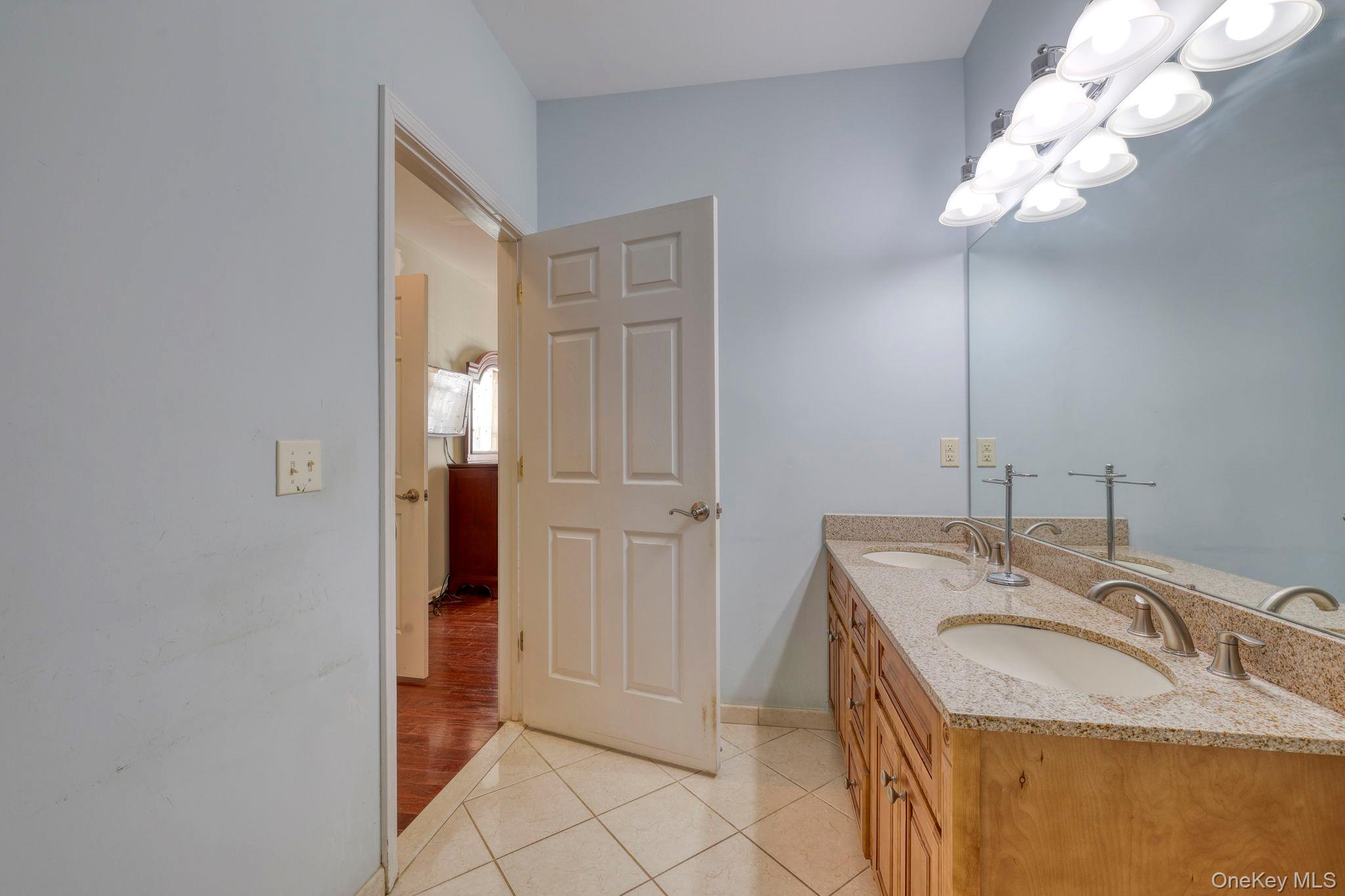 927 Tower Ridge Circle Middletown, NY 10941 - Photo 22 of 36 Full bath featuring double vanity and light tile patterned floors