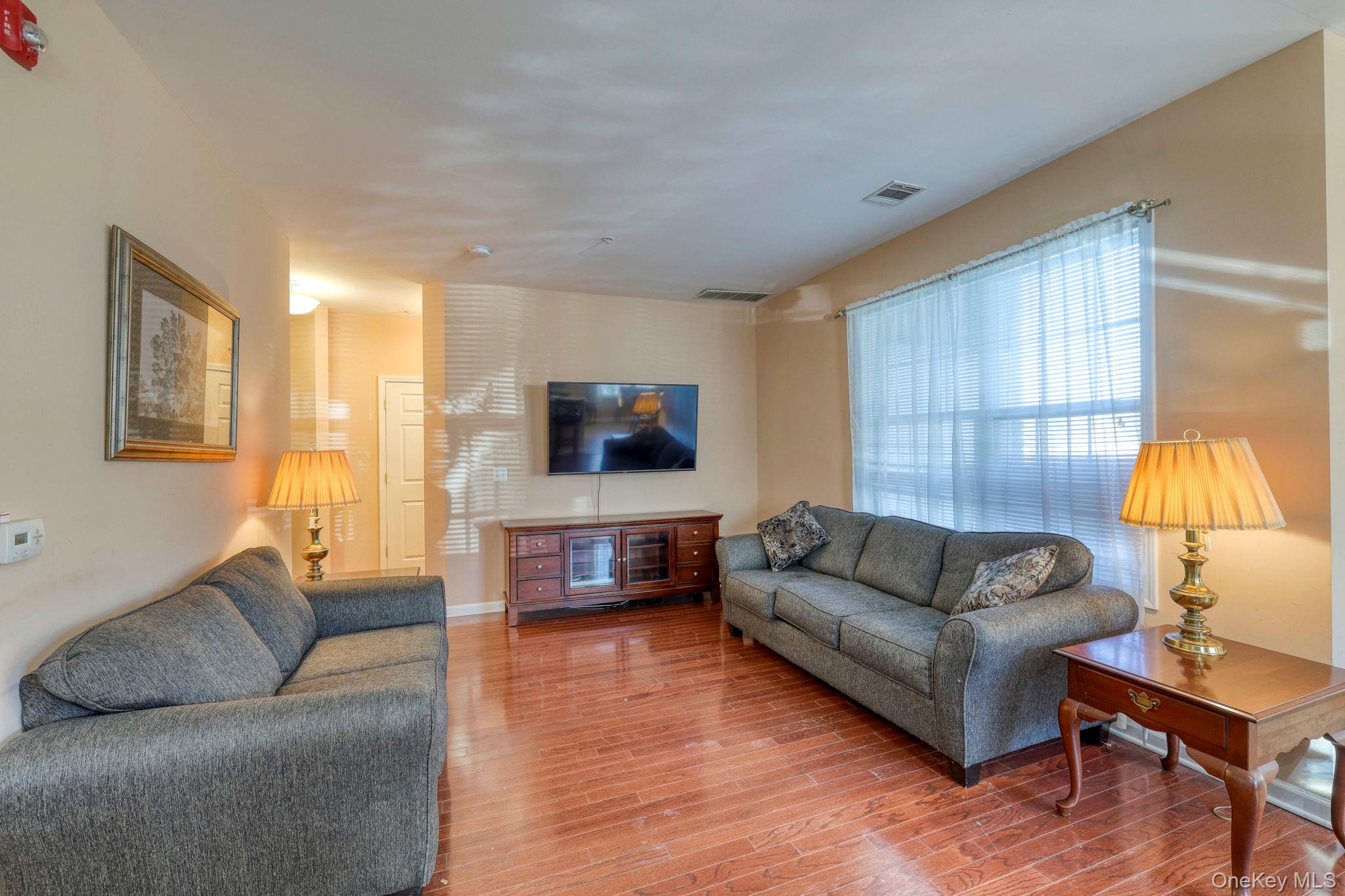 927 Tower Ridge Circle Middletown, NY 10941 - Photo 24 of 36 Living area with wood finished floors