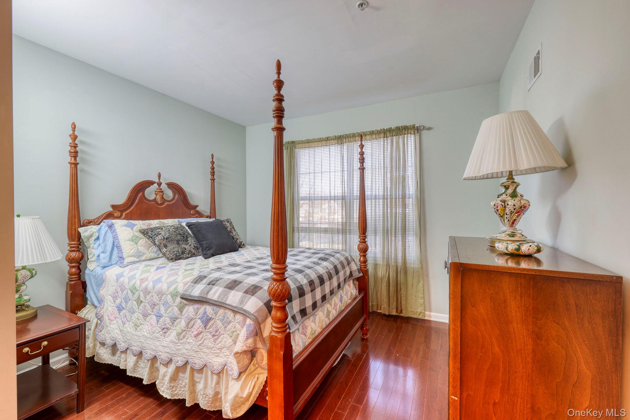927 Tower Ridge Circle Middletown, NY 10941 - Photo 26 of 36 Bedroom featuring dark wood-style flooring and baseboards