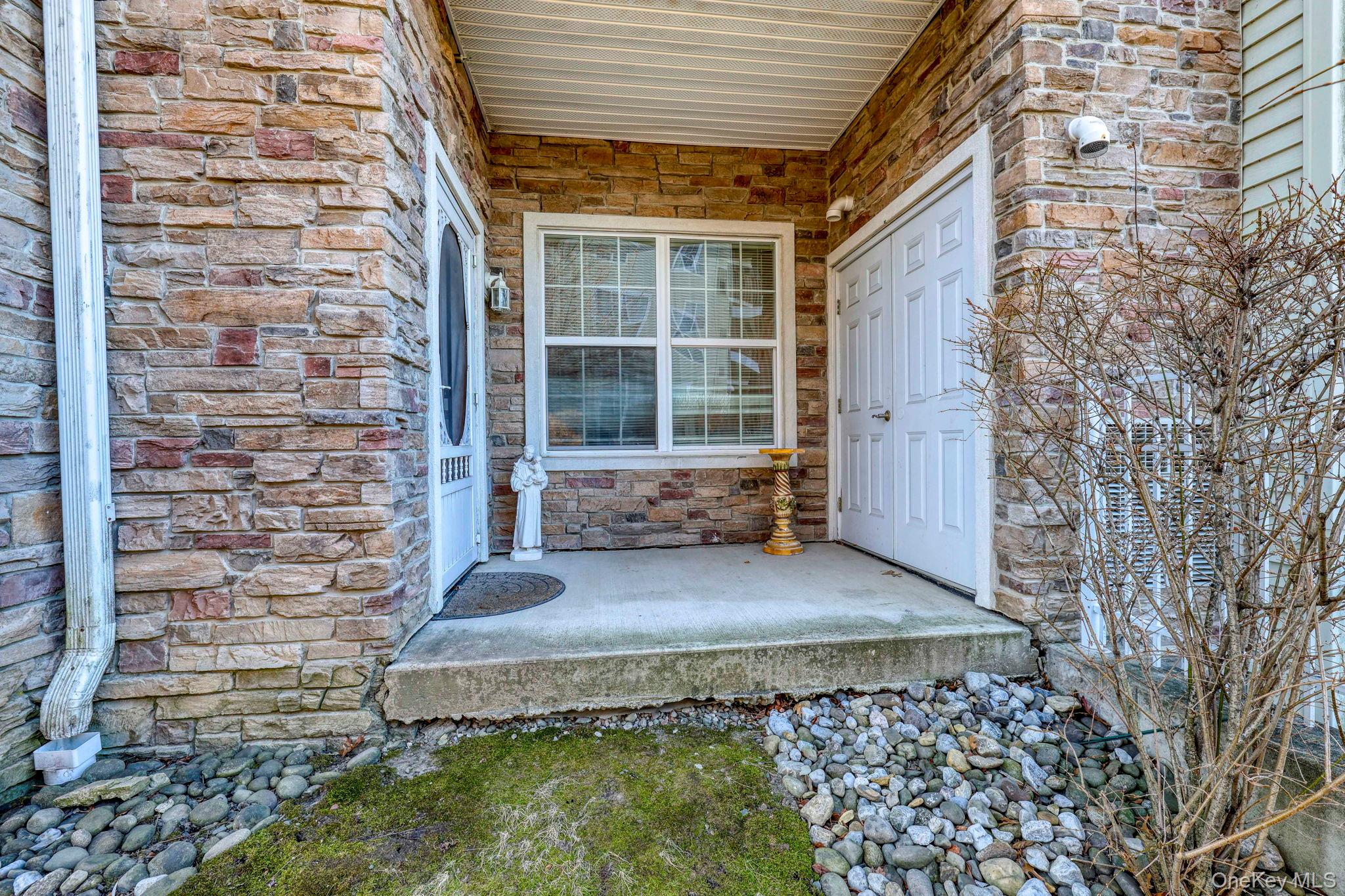927 Tower Ridge Circle Middletown, NY 10941 - Photo 28 of 36 View of exterior entry featuring stone siding