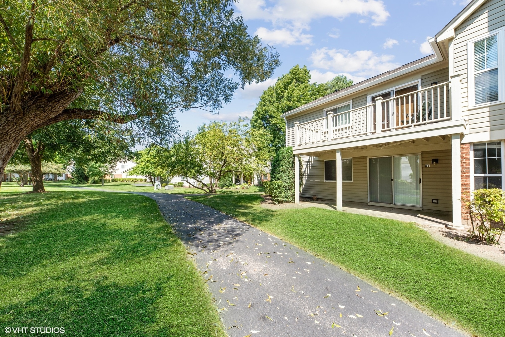 1406 Aldgate Court, Unit D1 Wheeling, IL 60090 - Photo 16 of 16 front view of a house with a yard
