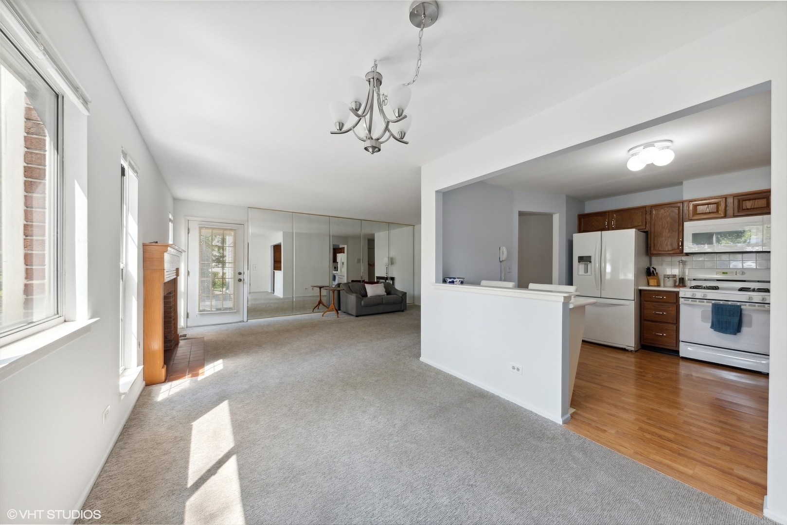 1406 Aldgate Court, Unit D1 Wheeling, IL 60090 - Photo 8 of 16 a view of a kitchen with a sink and dishwasher a refrigerator with wooden floor