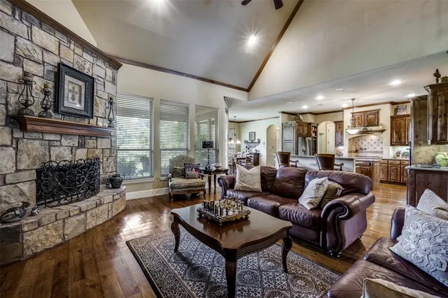 a living room with furniture fireplace and a fireplace