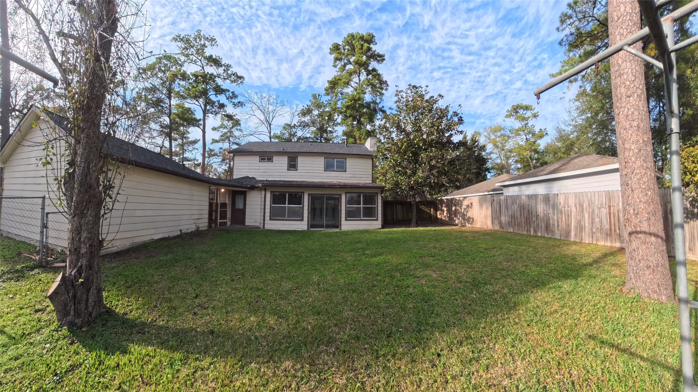 7711 Kleingreen Lane Spring, TX 77379 - Photo 13 of 14 a view of a yard in front of a house with large tree