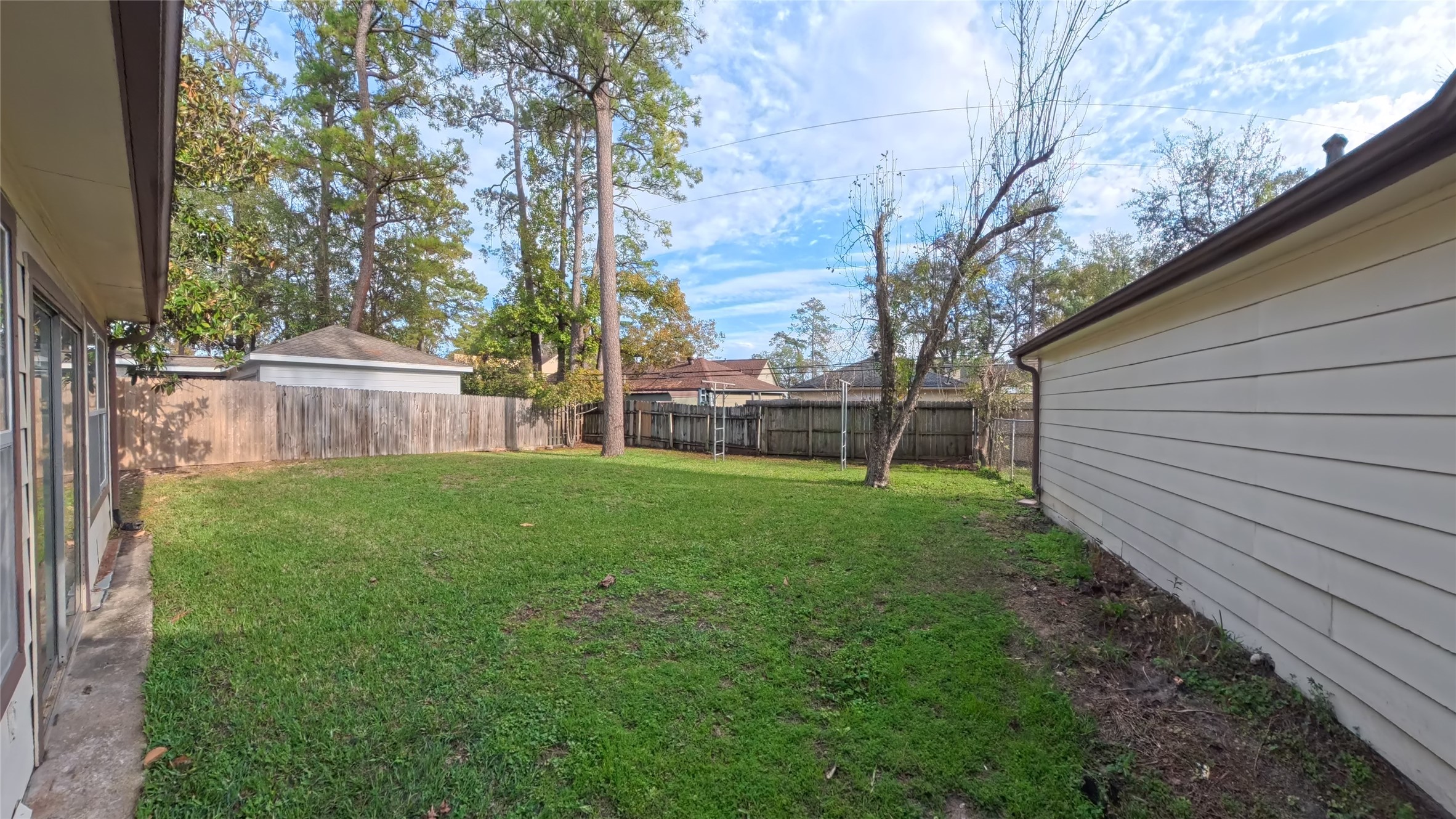 7711 Kleingreen Lane Spring, TX 77379 - Photo 14 of 14 a view of a backyard with plants and large tree