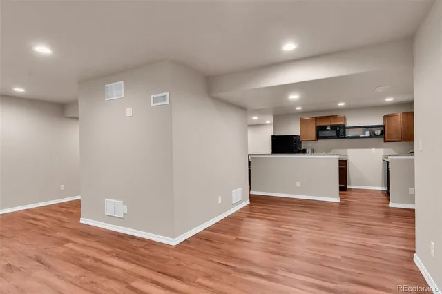 a view of kitchen with wooden floor