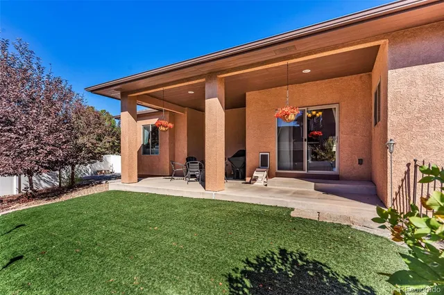 a view of a house with a tree