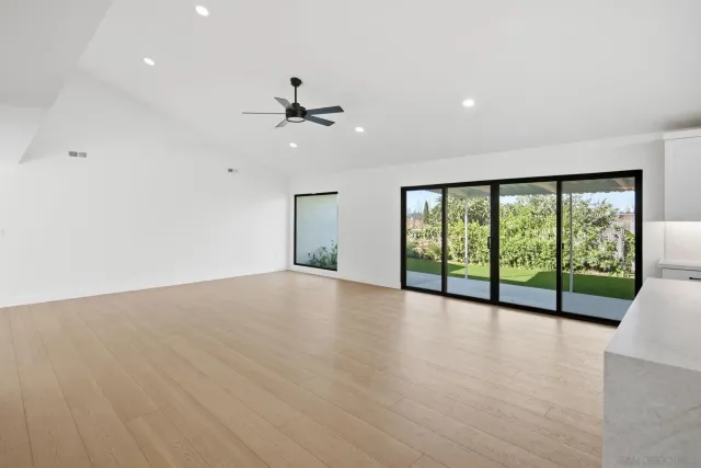 a bathroom with a shower sink vanity and mirror