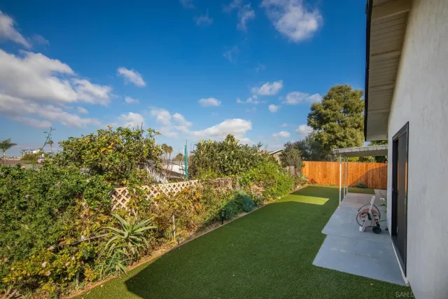 a front view of a house with yard