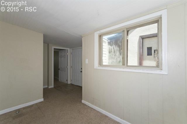615 Sunset Road Colorado Springs, CO 80909 - Photo 8 of 20 This is a great area! Nice Sun Room or Office area.