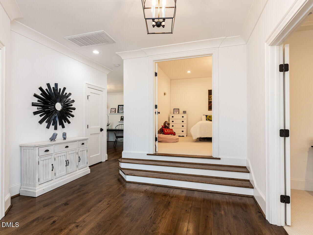 5309 Alpine Drive Raleigh, NC 27609 - Photo 25 of 67 a view of a hallway with wooden floor and cabinet