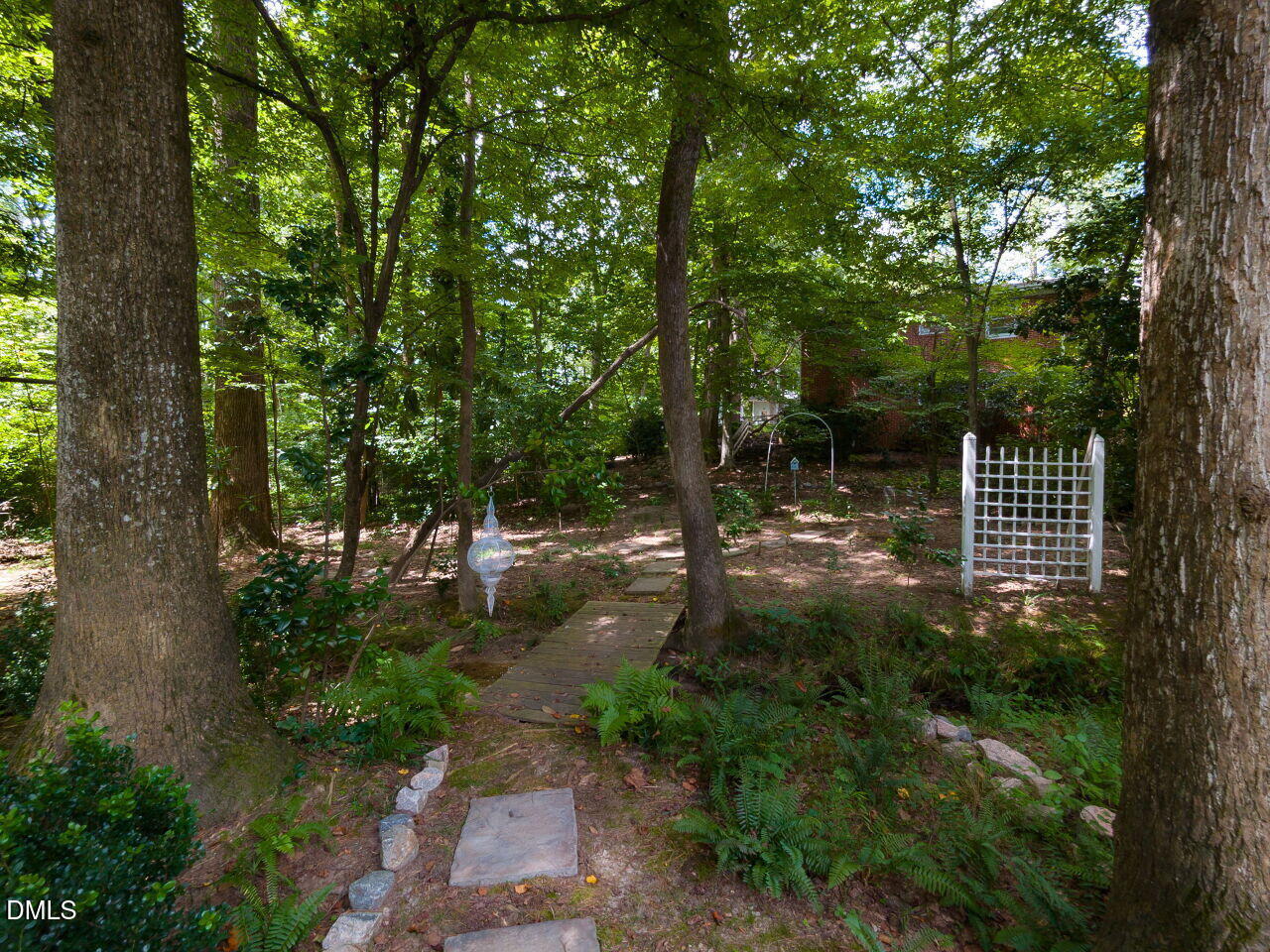 5309 Alpine Drive Raleigh, NC 27609 - Photo 61 of 67 a backyard of a house with lots of green space