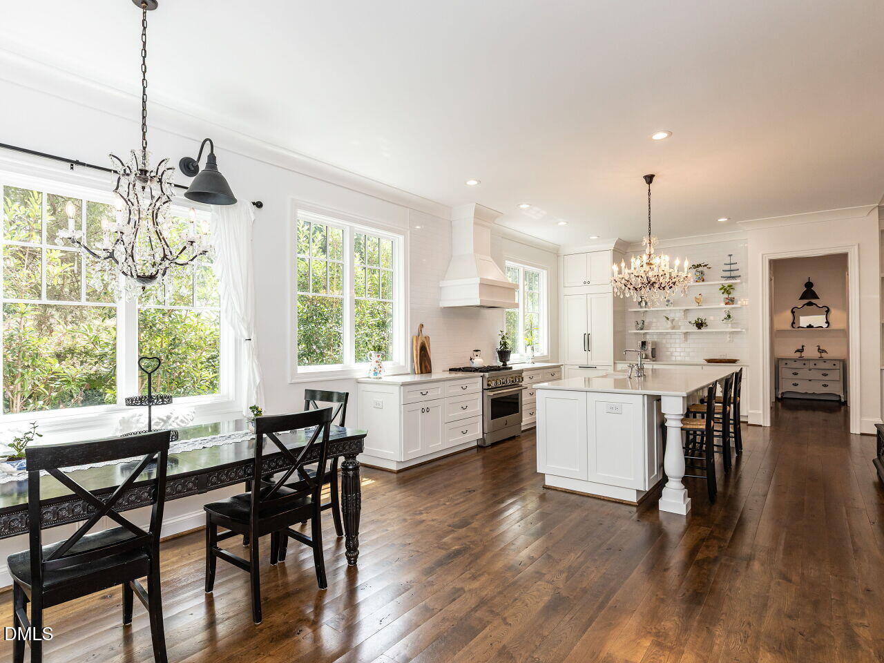 5309 Alpine Drive Raleigh, NC 27609 - Photo 8 of 67 a large kitchen with dining table chairs and wooden floor