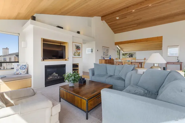 a bedroom with a large bed and a tv
