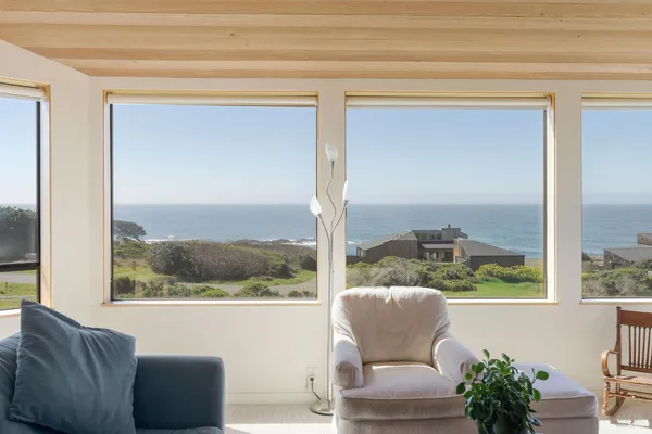 a dining hall with stainless steel appliances kitchen island granite countertop a dining table chairs and view of living room