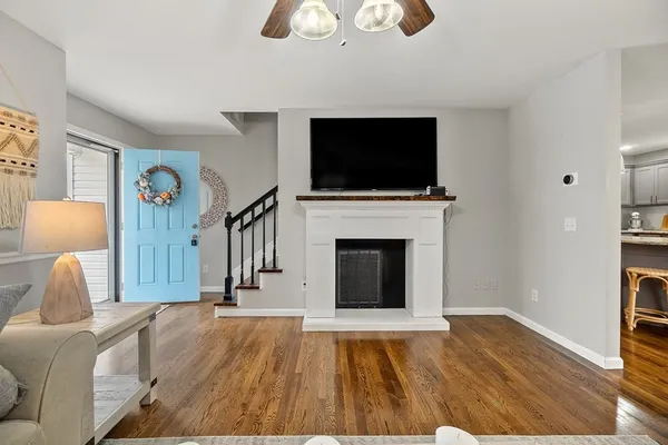 a living room with furniture fireplace and flat screen tv