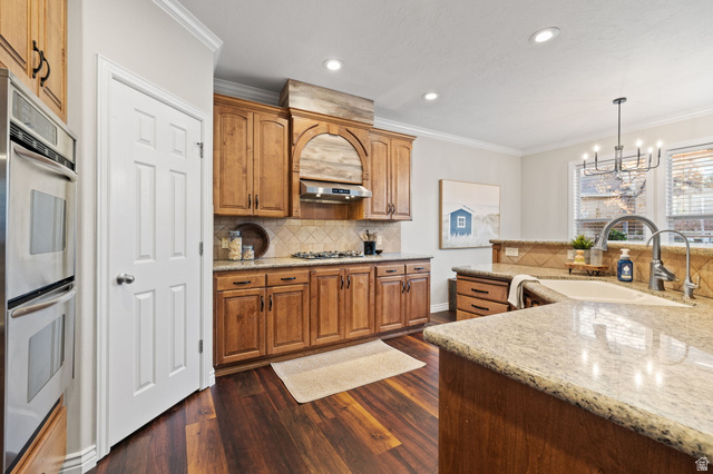 6208 West Bull River Road Highland, UT 84003 - Photo 23 of 90 Kitchen featuring wood-finish flooring, light wood cabinetry, stainless steel double ovens, a gas cooktop, and granite countertops