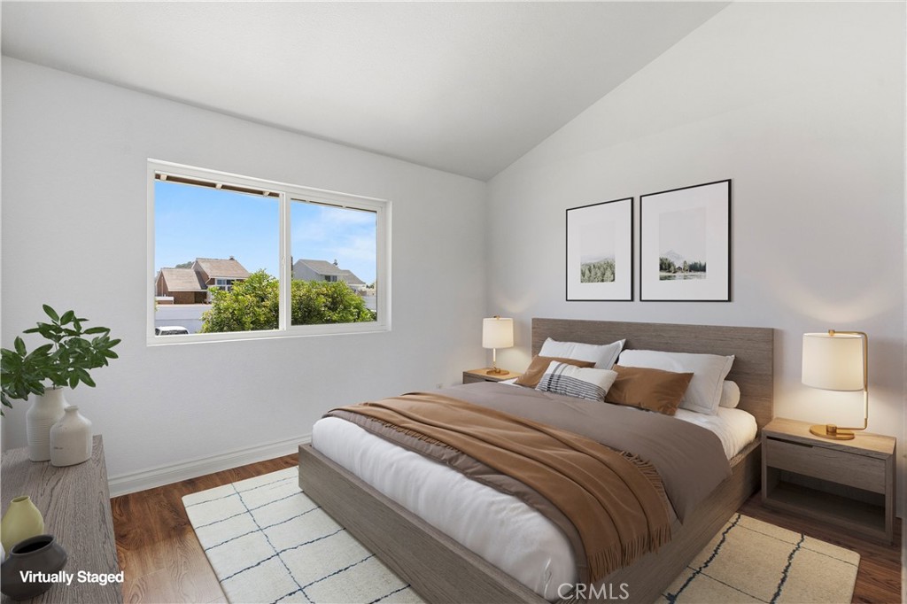 33585 Via Corvalian, Unit 7 Dana Point, CA 92629 - Photo 28 of 50 Spacious secondary bedroom with large window, natural light, and versatile layout for guests or office use. Virtually staged.
