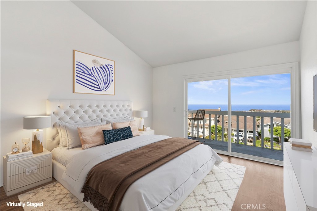 33585 Via Corvalian, Unit 7 Dana Point, CA 92629 - Photo 30 of 50 Spacious secondary bedroom with large window, natural light, and versatile layout for guests or office use. Virtually staged.