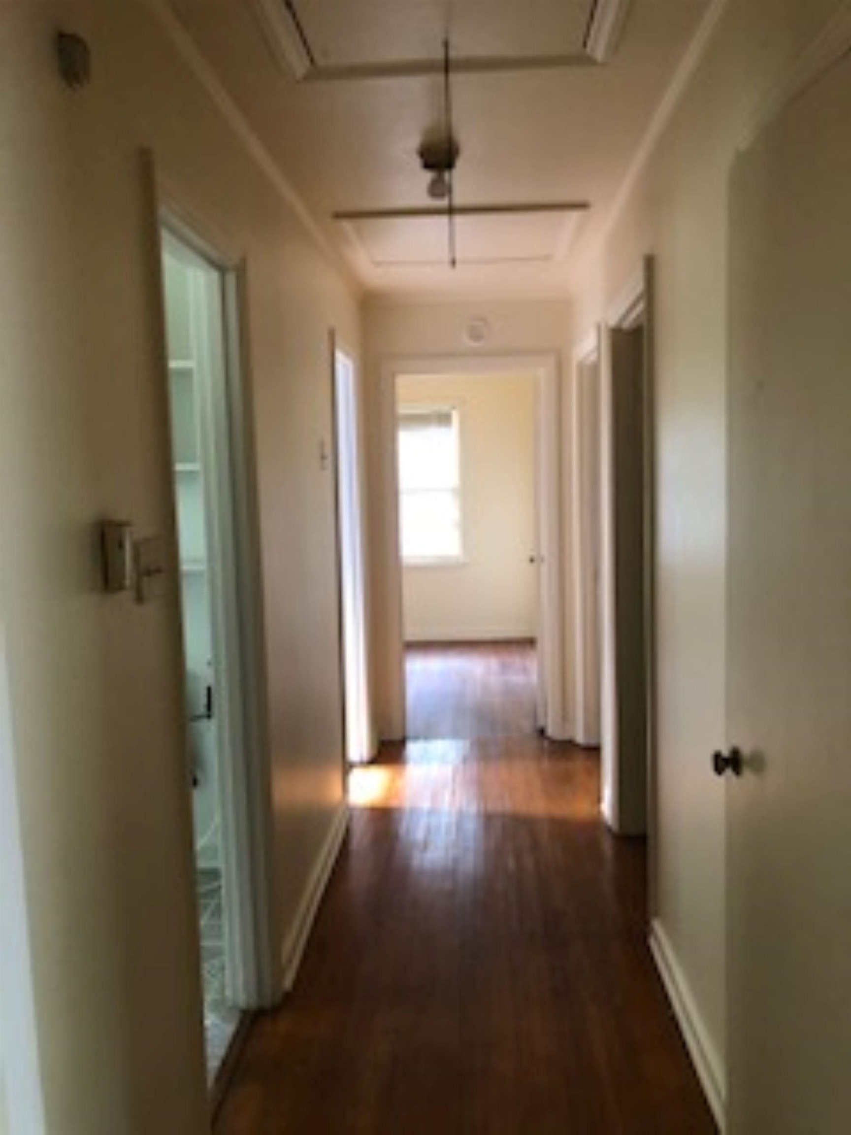 1048 Avon Road Memphis, TN 38122 - Photo 6 of 10 a view of a hallway with wooden floor