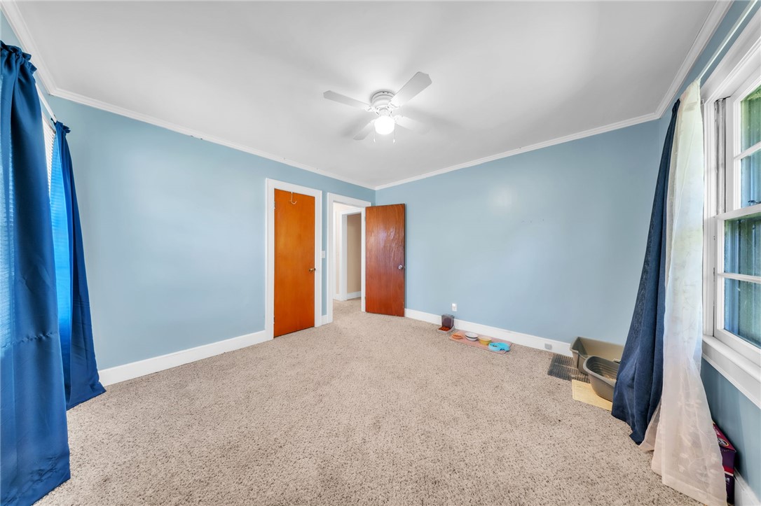 107 Burton Road Anderson, SC 29625 - Photo 22 of 33 Soft carpeting pairs with classic trim work in this versatile secondary bedroom space.