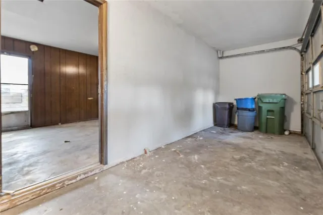 a view of an empty room with a fireplace