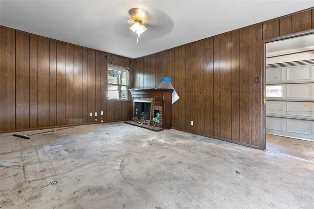 a view of an empty room with a fireplace
