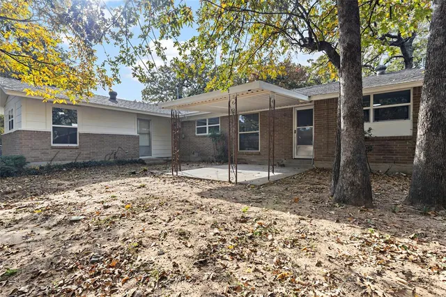 a backyard of a house with seating space