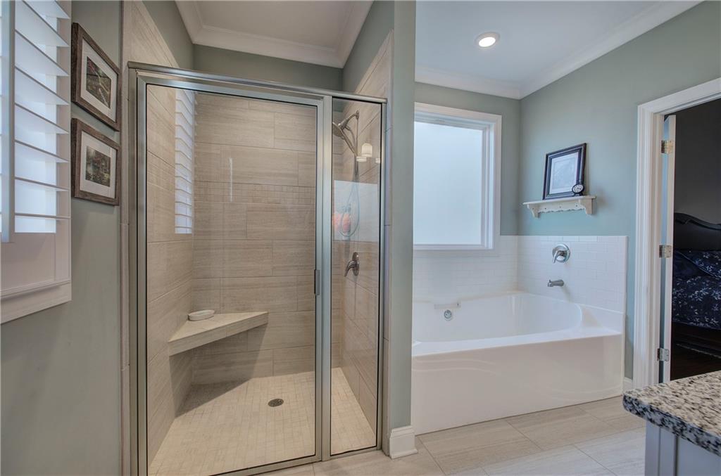 20 Encore Lane Cartersville, GA 30120 - Photo 37 of 44 a bathroom with a bathtub and a shower