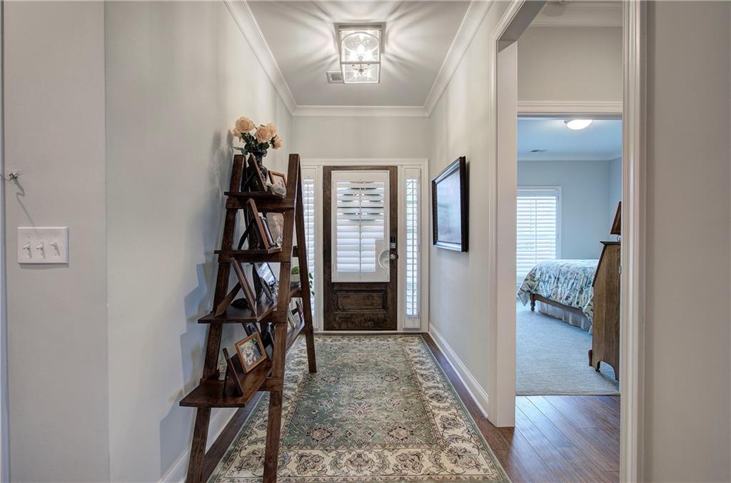 20 Encore Lane Cartersville, GA 30120 - Photo 9 of 44 a view of a hallway with wooden floor and stairs