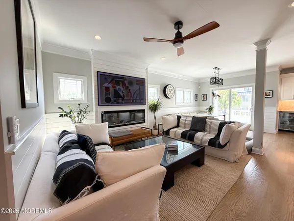 a kitchen with a table chairs refrigerator and cabinets