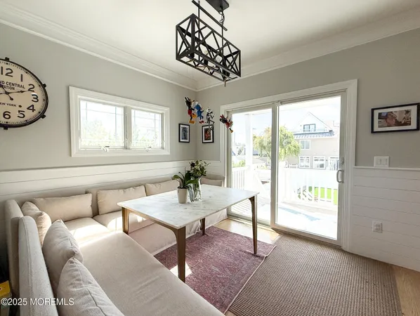 a large kitchen with a table and chairs