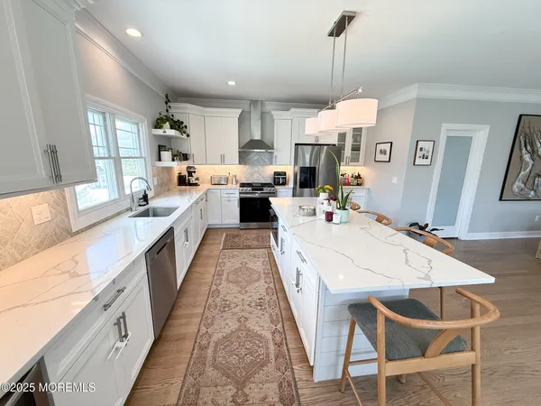 a utility room with sink dryer and washer