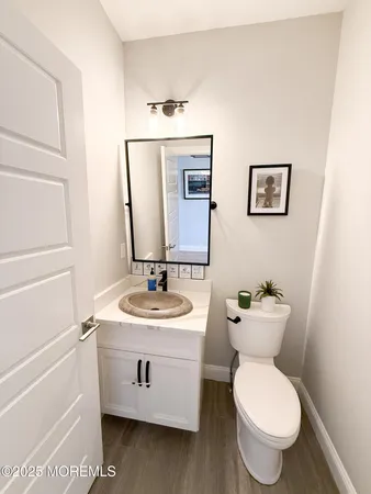 a bedroom with a bed dresser and a window