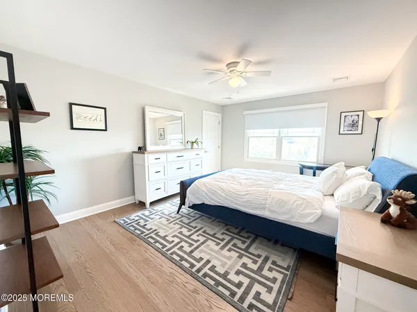 a view of walk in closet with clothes