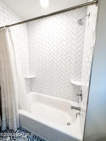 a bathroom with a double vanity sink and mirror