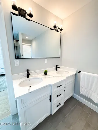 a view of a roof deck with couches and sky view
