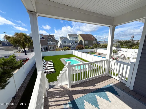 a view of a patio with a table chairs and a porch